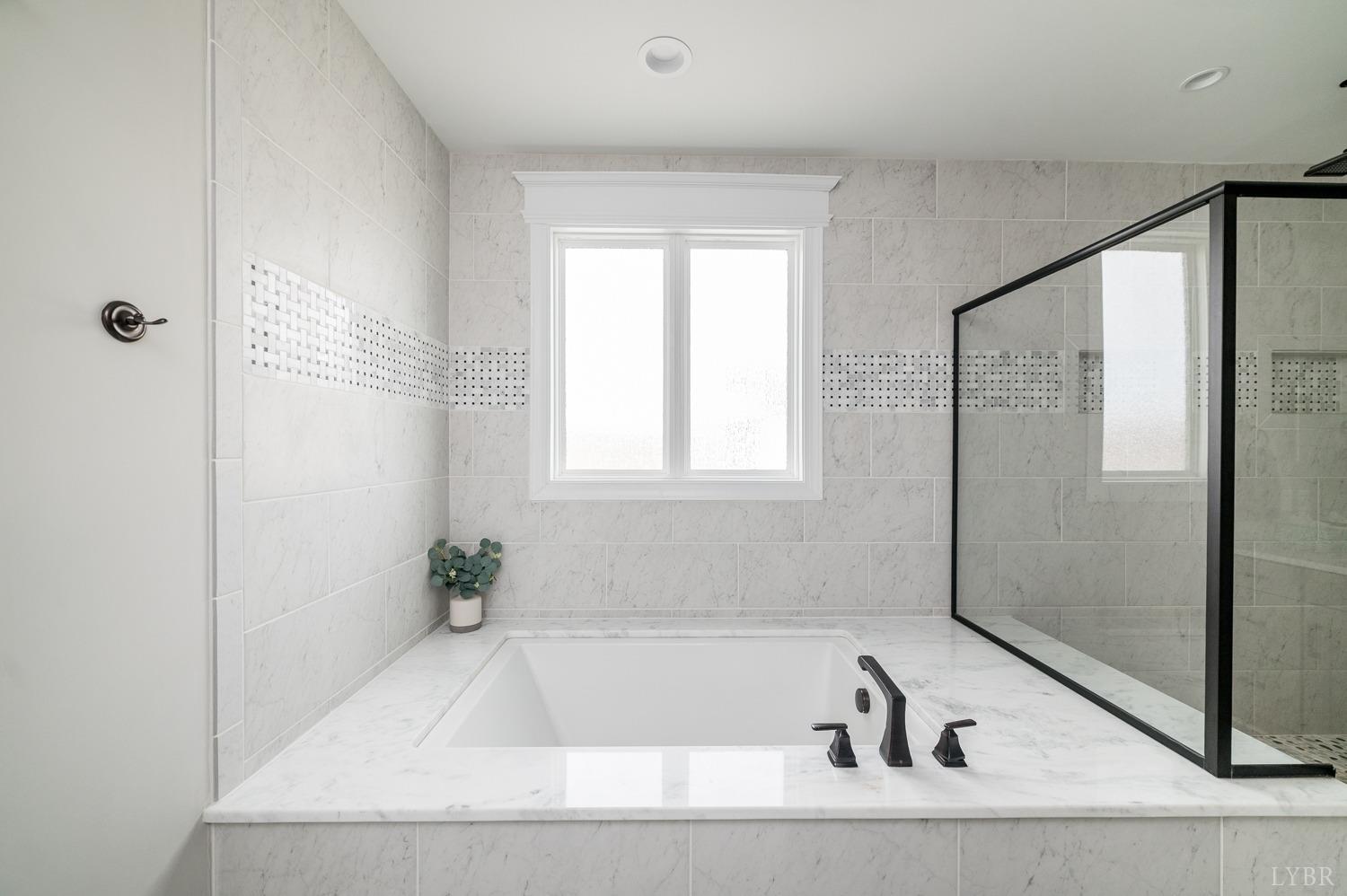 967 Lynbrook Road Rustburg, VA 24588 - Photo 59 of 99 a bathroom with a bathtub and shower