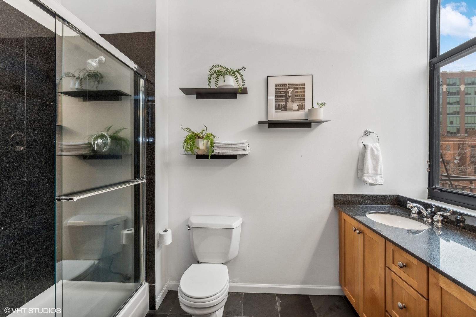 215 North Aberdeen Street, Unit 405A Chicago, IL 60607 - Photo 16 of 20 a bathroom with a toilet sink and shower