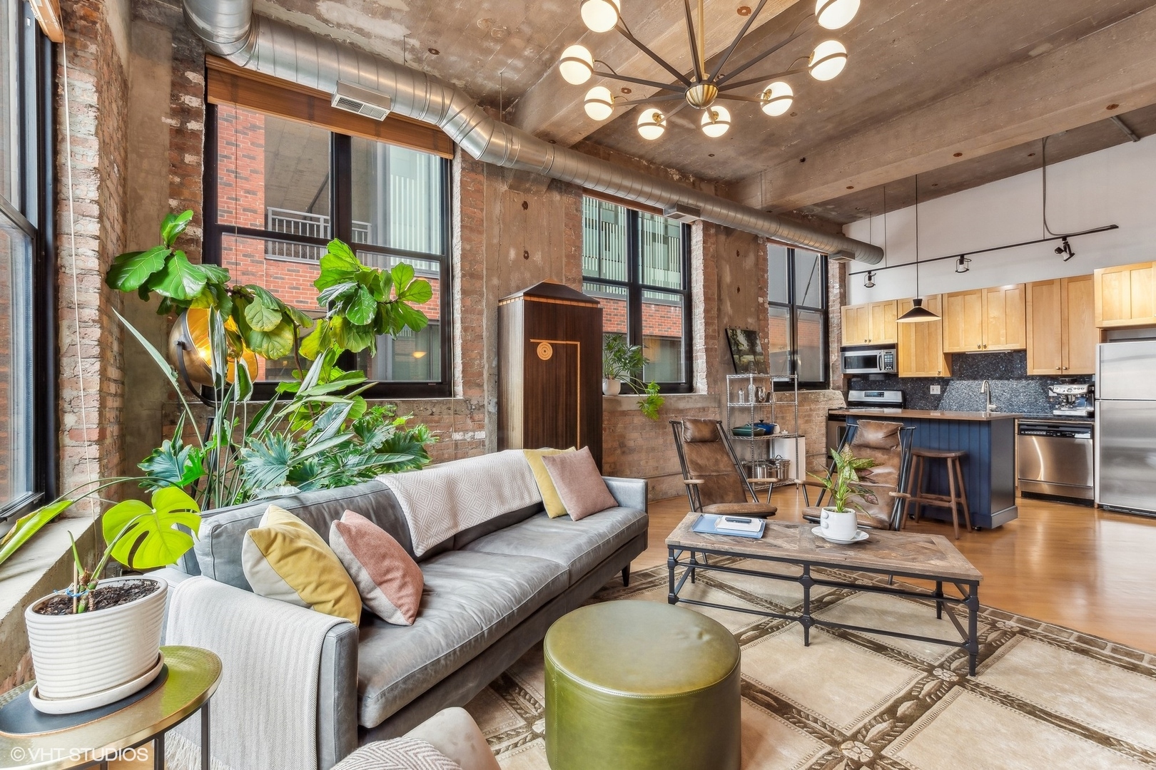 215 North Aberdeen Street, Unit 405A Chicago, IL 60607 - Photo 4 of 20 a living room with patio furniture and a potted plant