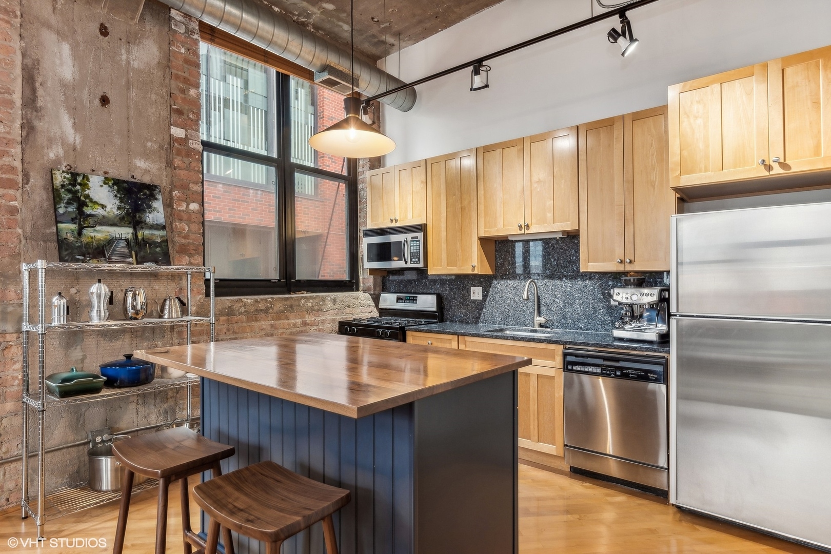 215 North Aberdeen Street, Unit 405A Chicago, IL 60607 - Photo 6 of 20 a kitchen with stainless steel appliances granite countertop a sink stove and refrigerator