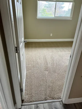 an empty room with wooden floor
