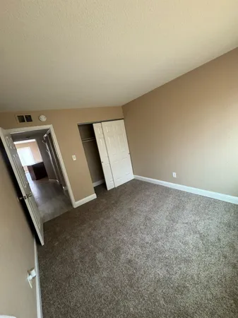 an empty room with a fireplace