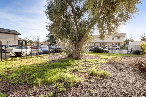 a view of cars parked in front of a house