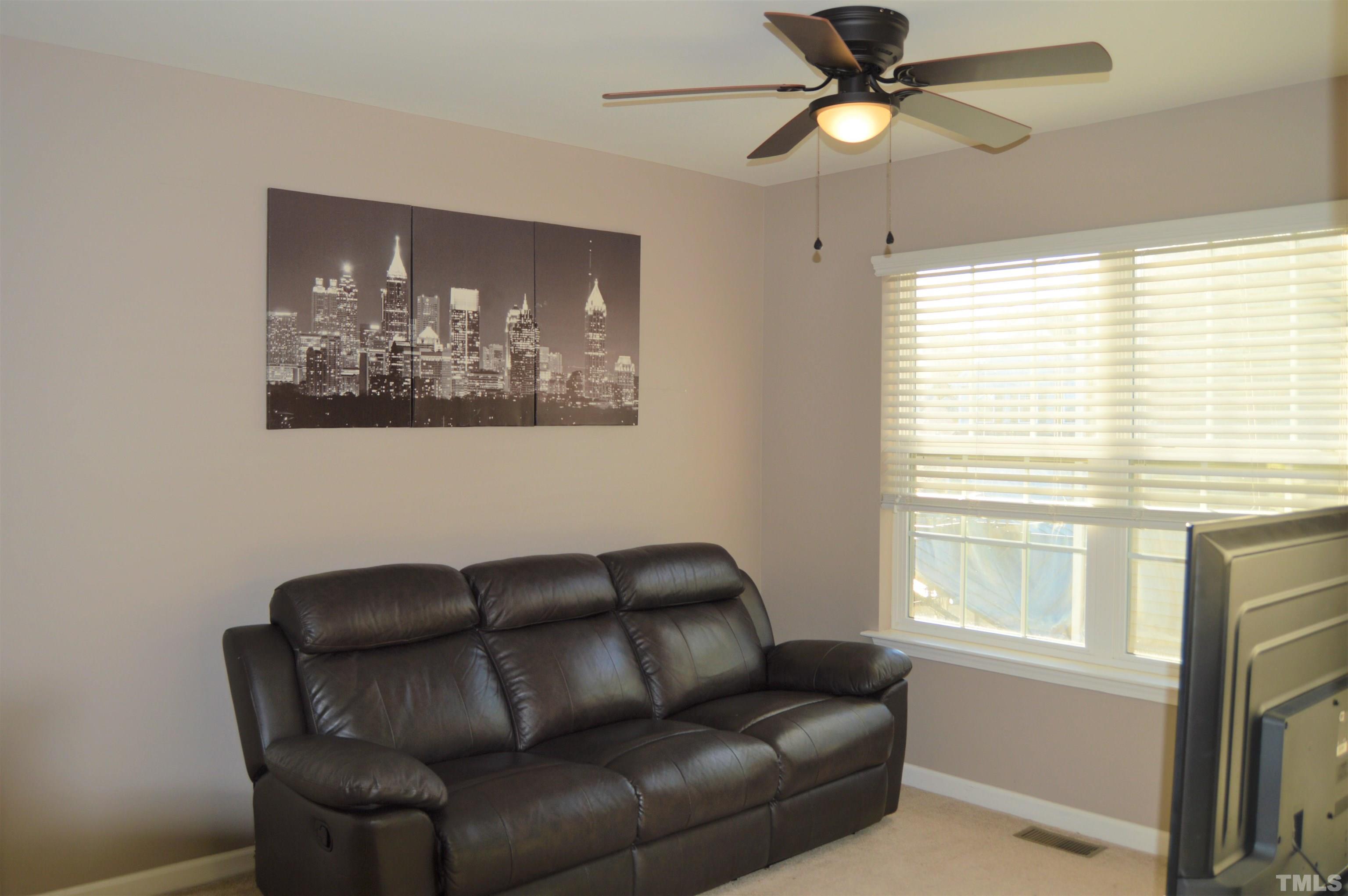 1308 Lombar Street Raleigh, NC 27610 - Photo 15 of 26 a living room with furniture and a window