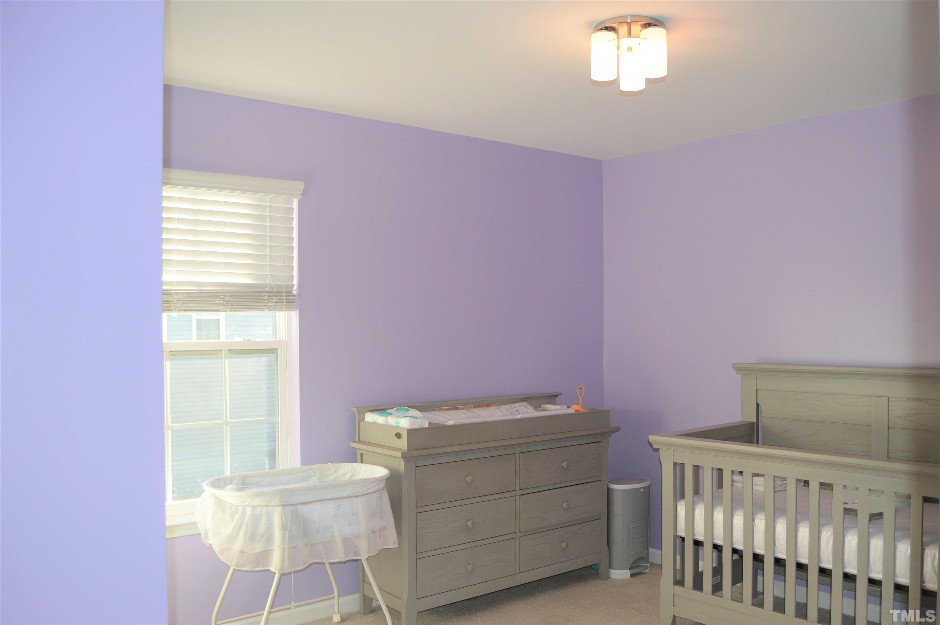 1308 Lombar Street Raleigh, NC 27610 - Photo 23 of 26 a bedroom with a bed and a window