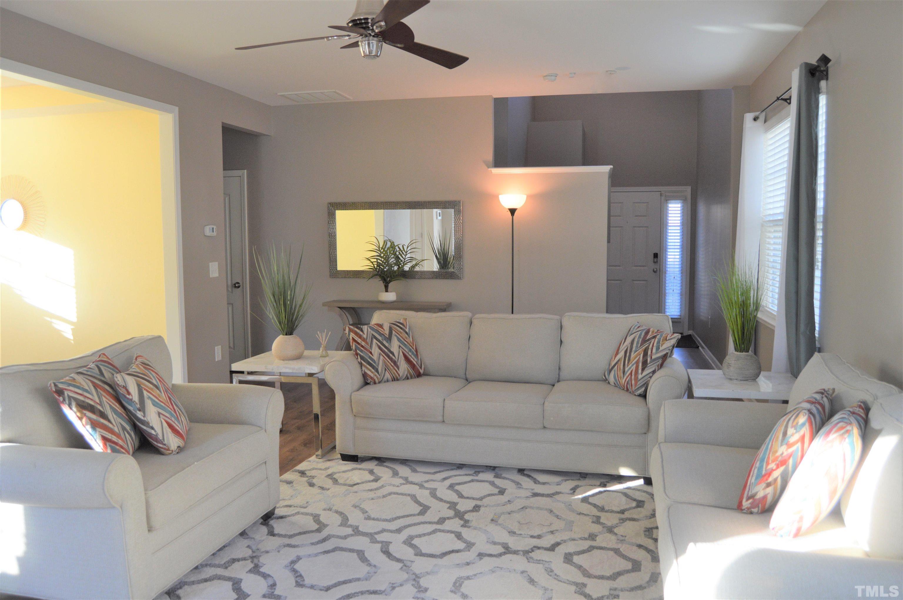 1308 Lombar Street Raleigh, NC 27610 - Photo 5 of 26 a living room with furniture and a flat screen tv