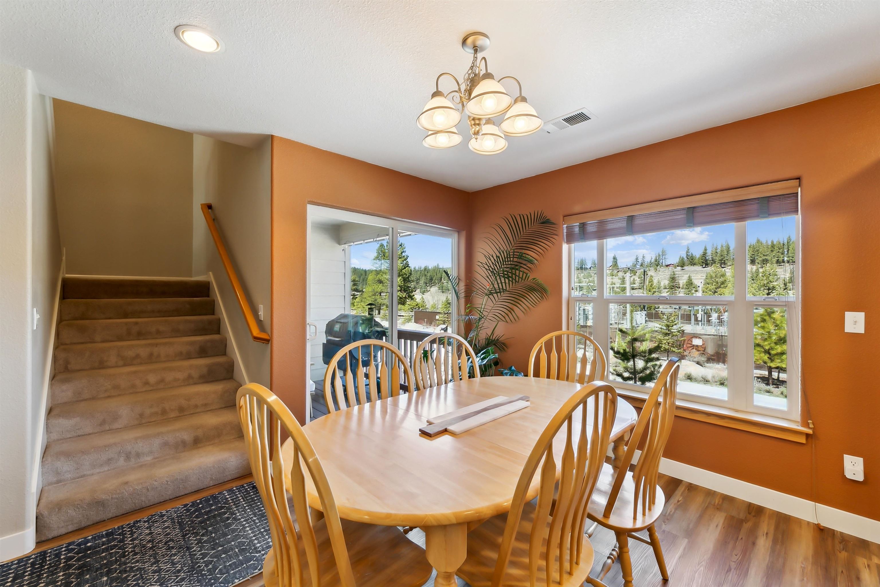 10096 Nicolas Drive, Unit C Truckee, CA 96161 - Photo 11 of 22 a view of a dining room with furniture window and wooden floor