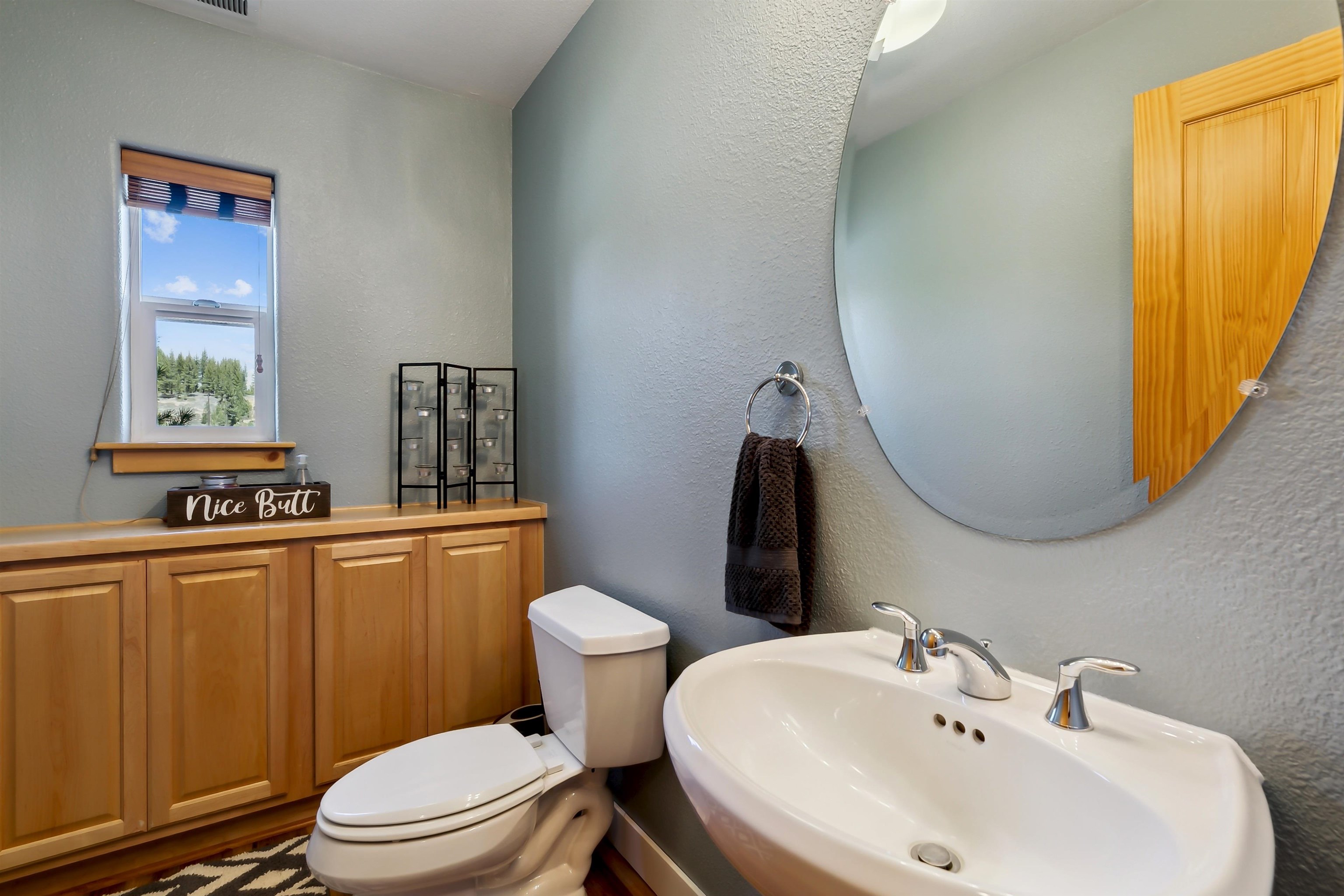10096 Nicolas Drive, Unit C Truckee, CA 96161 - Photo 12 of 22 a bathroom with a sink toilet and mirror