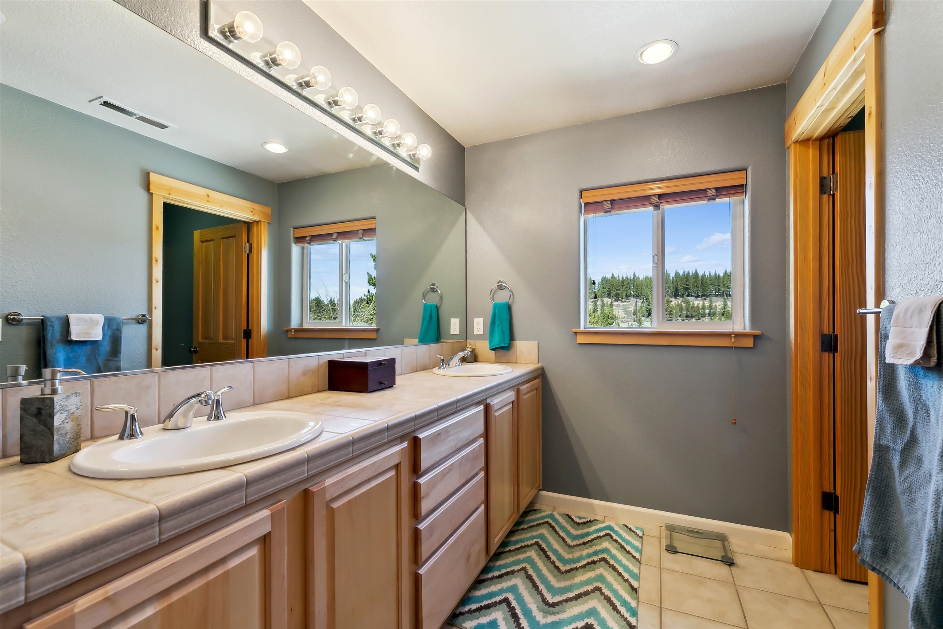 10096 Nicolas Drive, Unit C Truckee, CA 96161 - Photo 15 of 22 a bathroom with a sink and a mirror