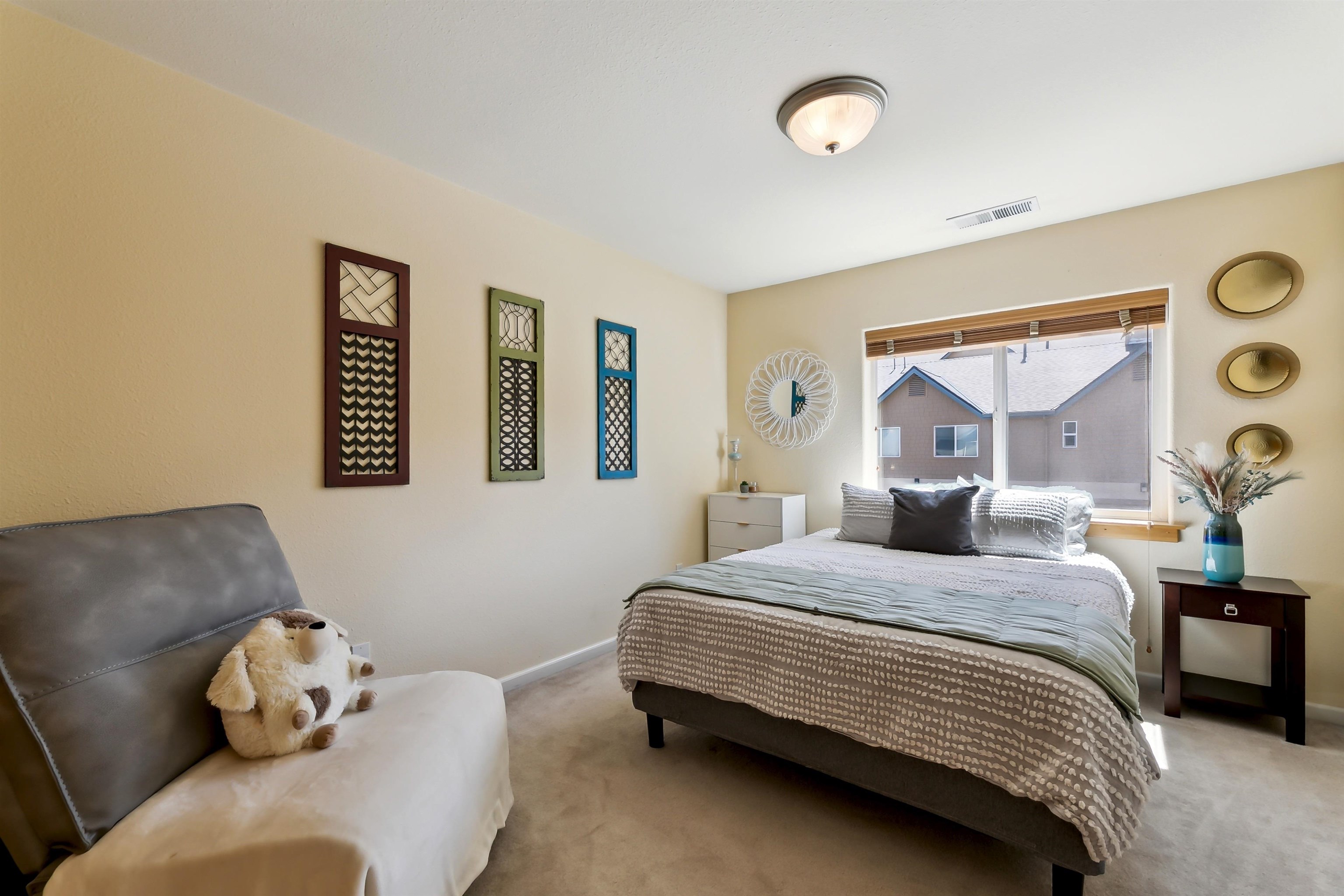 10096 Nicolas Drive, Unit C Truckee, CA 96161 - Photo 17 of 22 a bedroom with a bed and window