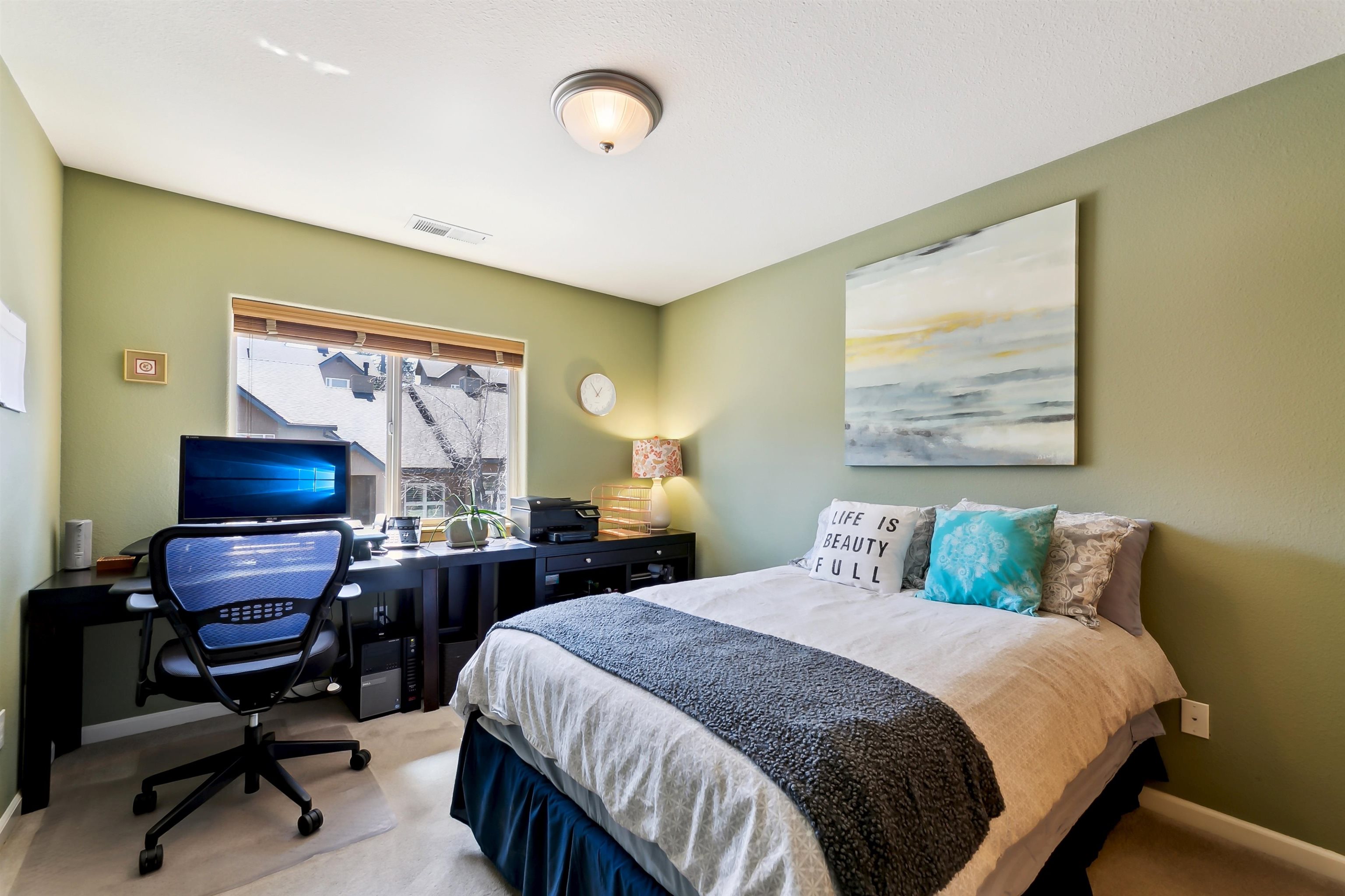 10096 Nicolas Drive, Unit C Truckee, CA 96161 - Photo 19 of 22 a bedroom with a bed and a desk