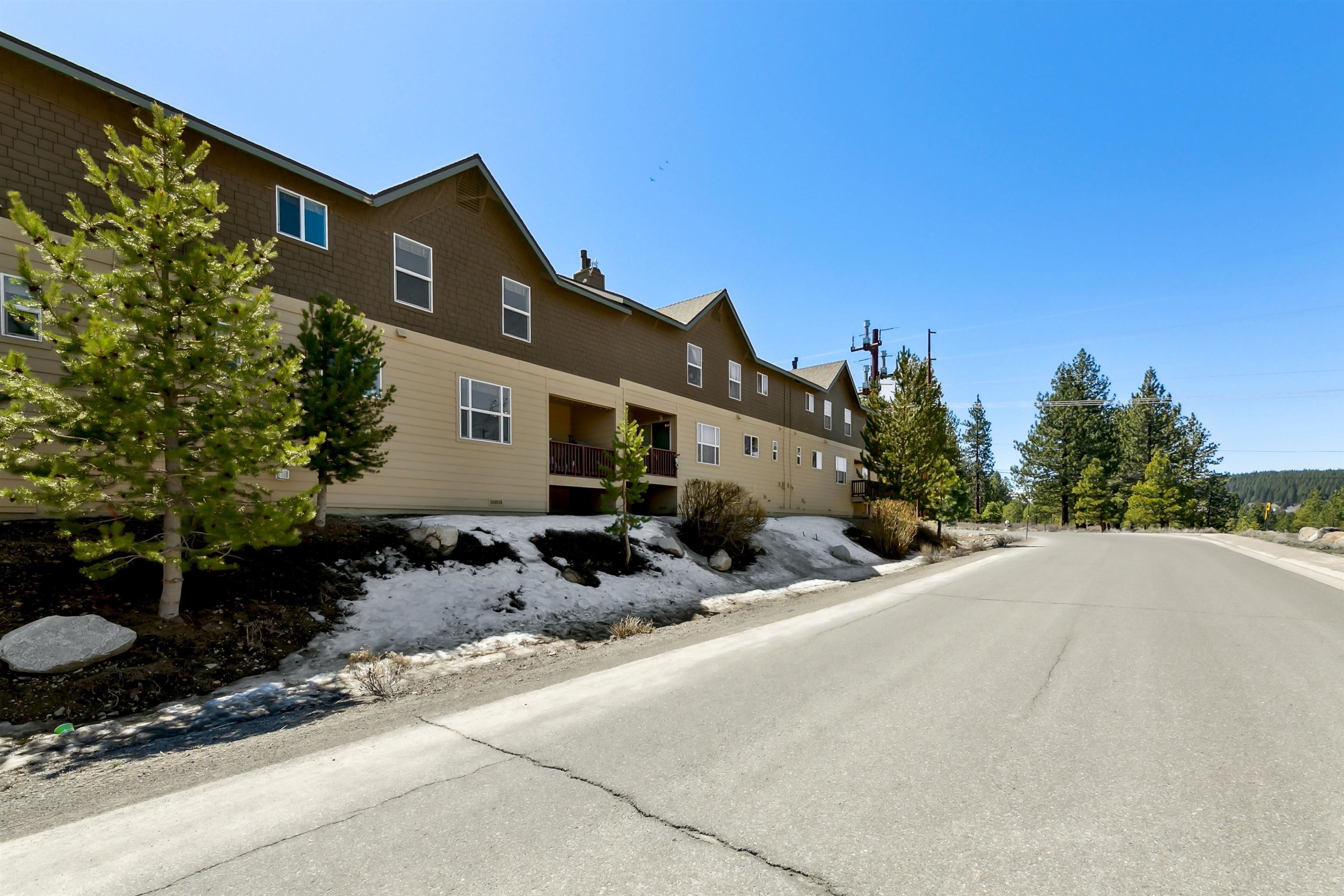 10096 Nicolas Drive, Unit C Truckee, CA 96161 - Photo 21 of 22 a front view of a house with a yard