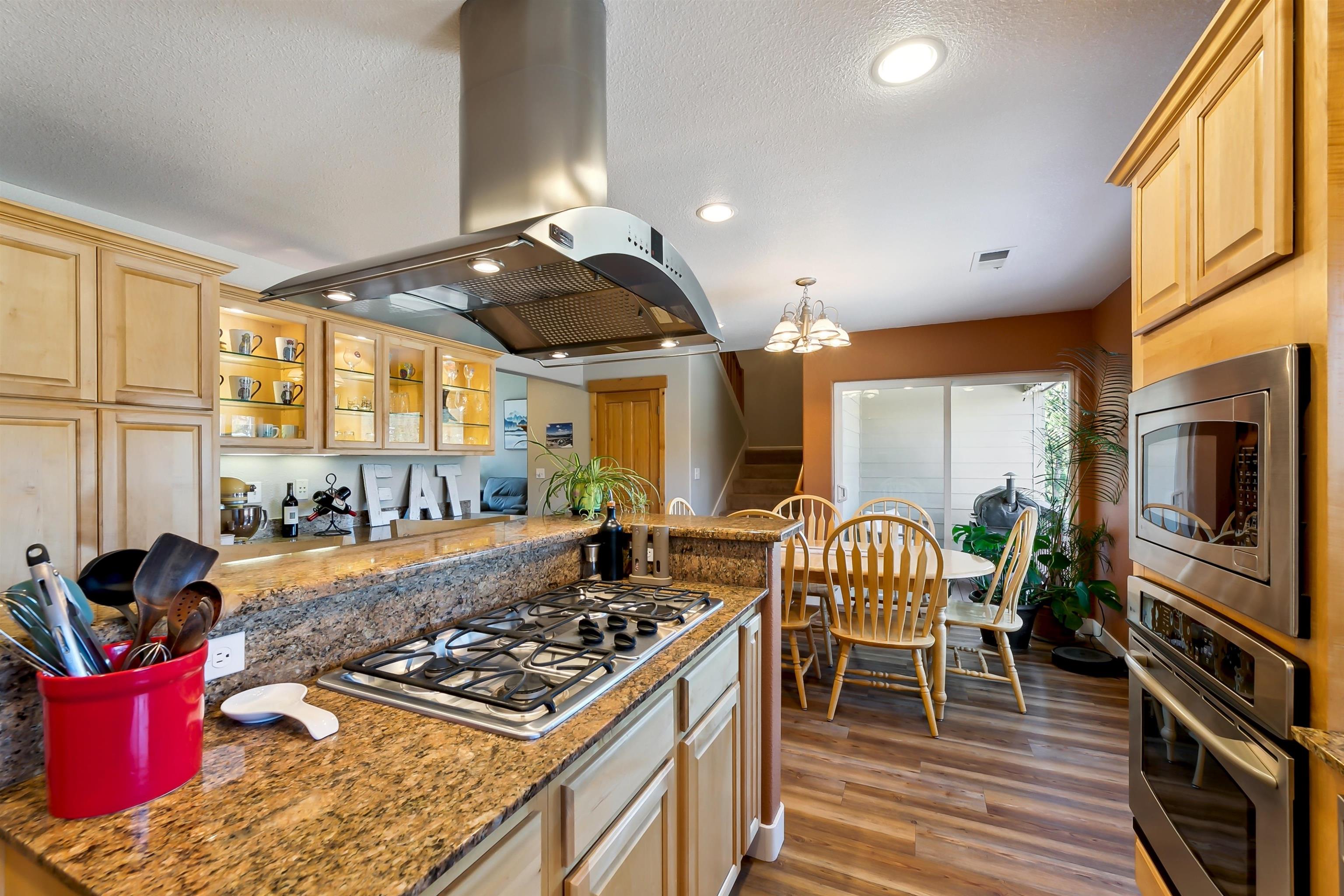 10096 Nicolas Drive, Unit C Truckee, CA 96161 - Photo 10 of 22 a kitchen with stainless steel appliances granite countertop a stove a sink and a refrigerator