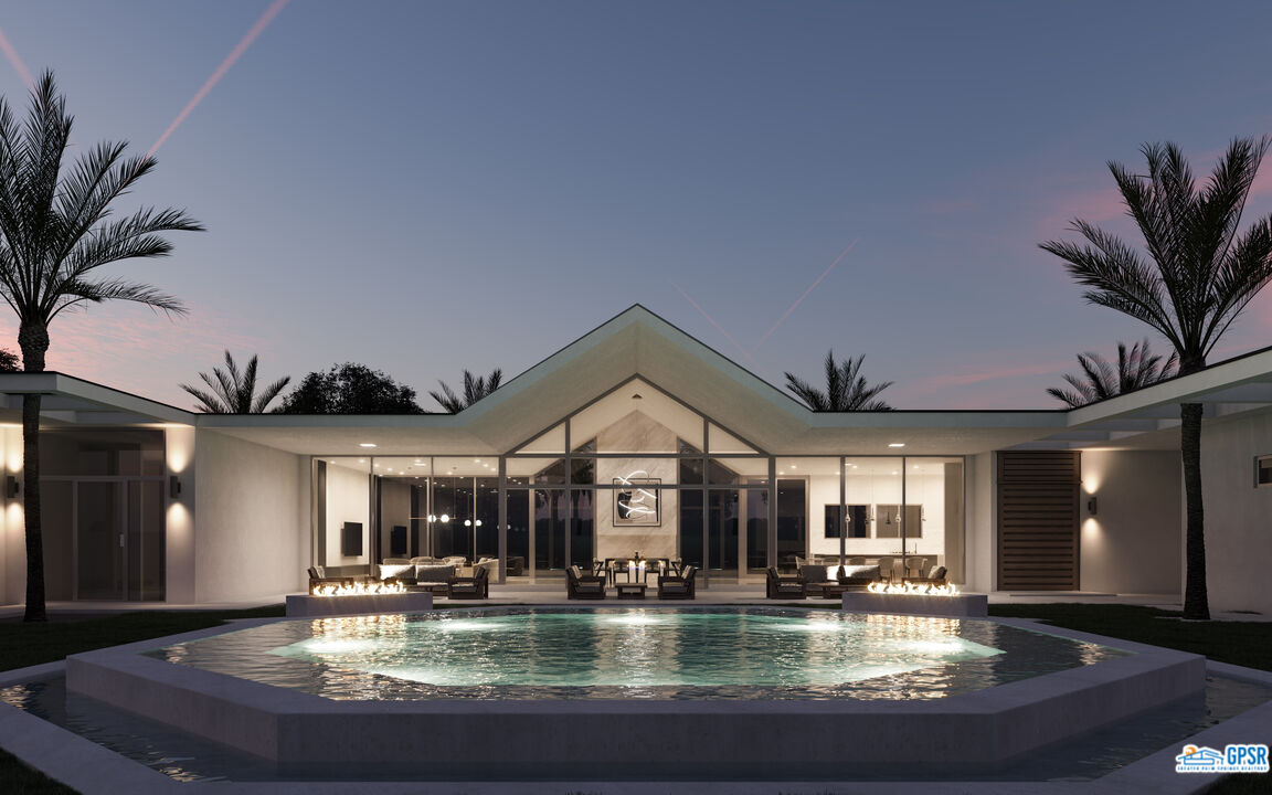 a view of a house with swimming pool and dining table