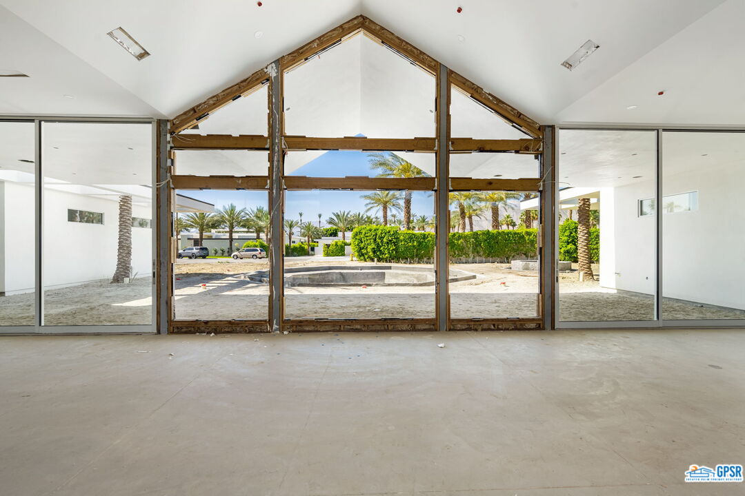 1 Makena Lane Rancho Mirage, CA 92270 - Photo 16 of 22 a view of an empty room with wooden floor and a window