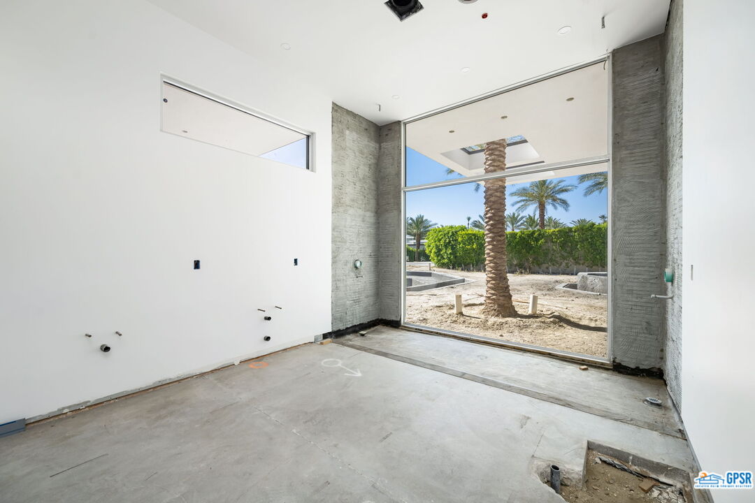 1 Makena Lane Rancho Mirage, CA 92270 - Photo 22 of 22 a view of a porch with wooden floor and windows