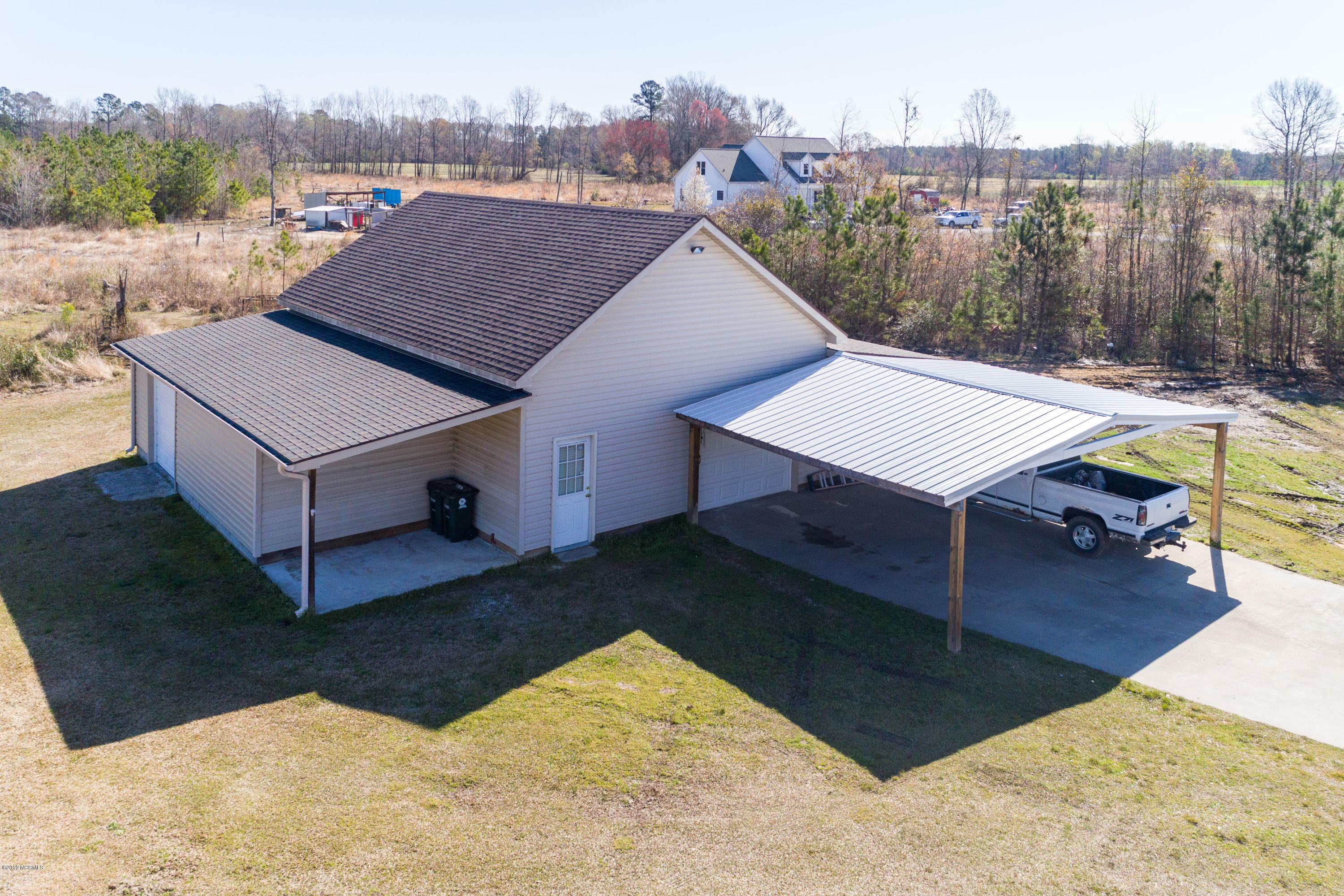 4768 Toddy Road Farmville, NC 27828 - Photo 14 of 68 Carport and workshop and concrete parking area