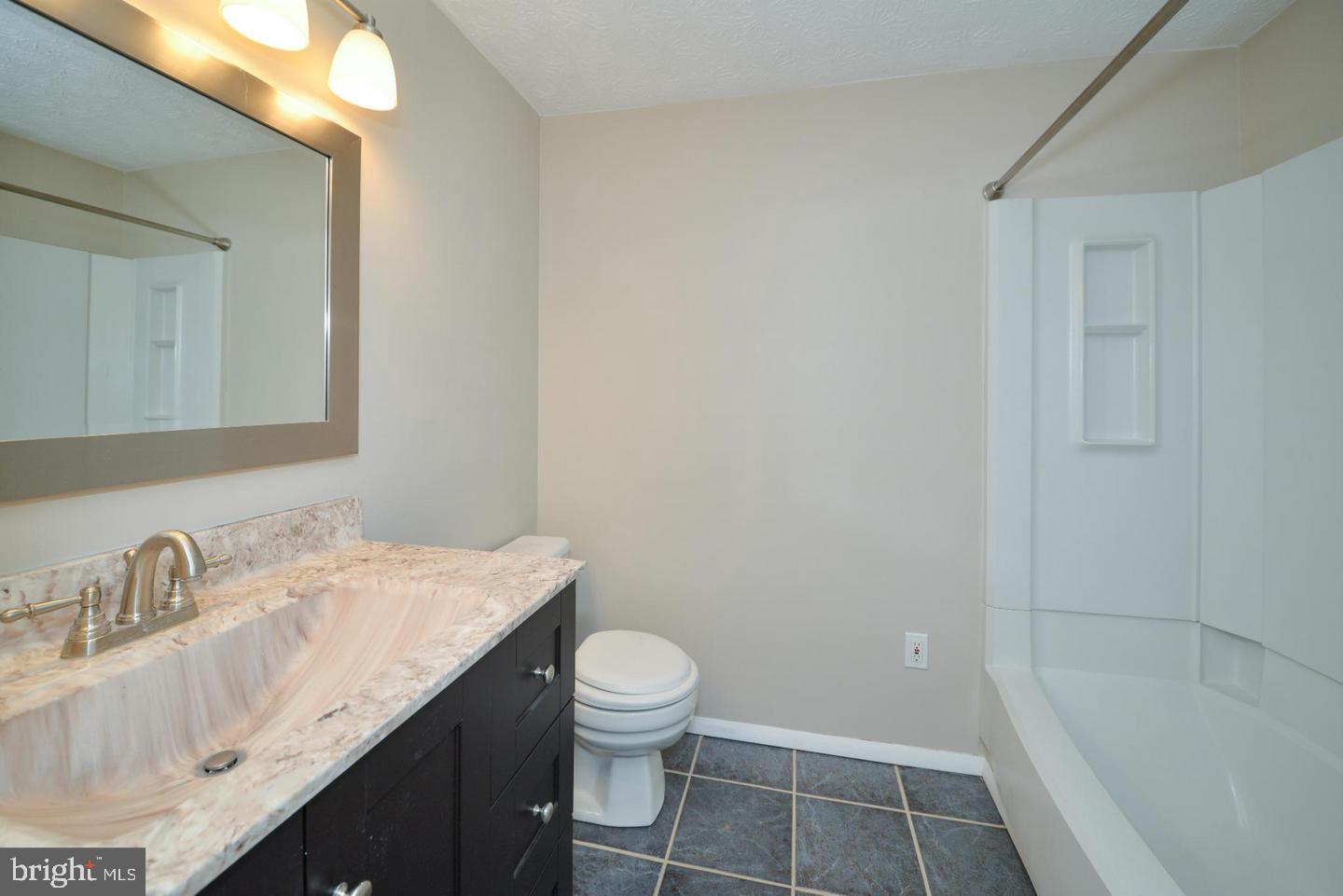 2331 Middle Creek Lane Reston, VA 20191 - Photo 14 of 15 Guest Bathroom, Tub Shower