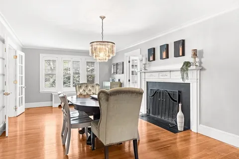 a view of a livingroom with furniture window and wooden floor