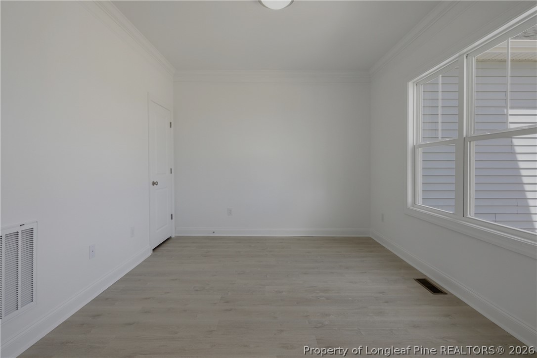 3187 Leaflet Church Road Broadway, NC 27505 - Photo 3 of 27 an empty room with a window