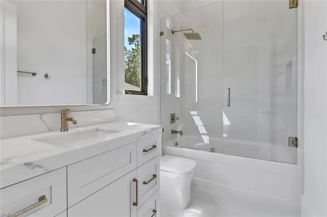 a bathroom with a sink a toilet and a bathtub