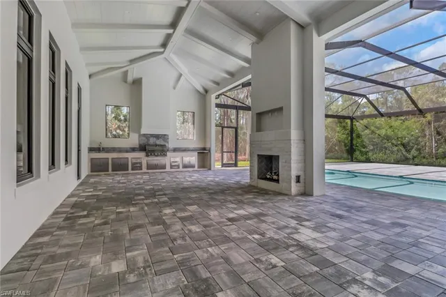 a view of a livingroom with furniture and a fireplace