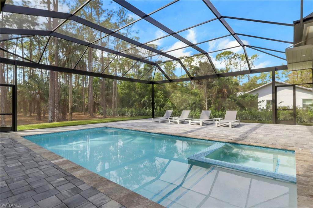 5174 Sycamore Drive Naples, FL 34119 - Photo 41 of 50 a view of indoor pool and sitting area