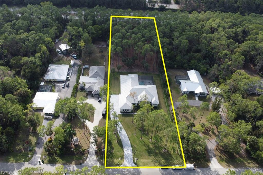 5174 Sycamore Drive Naples, FL 34119 - Photo 46 of 50 an aerial view of a house with a yard basket ball court and outdoor seating