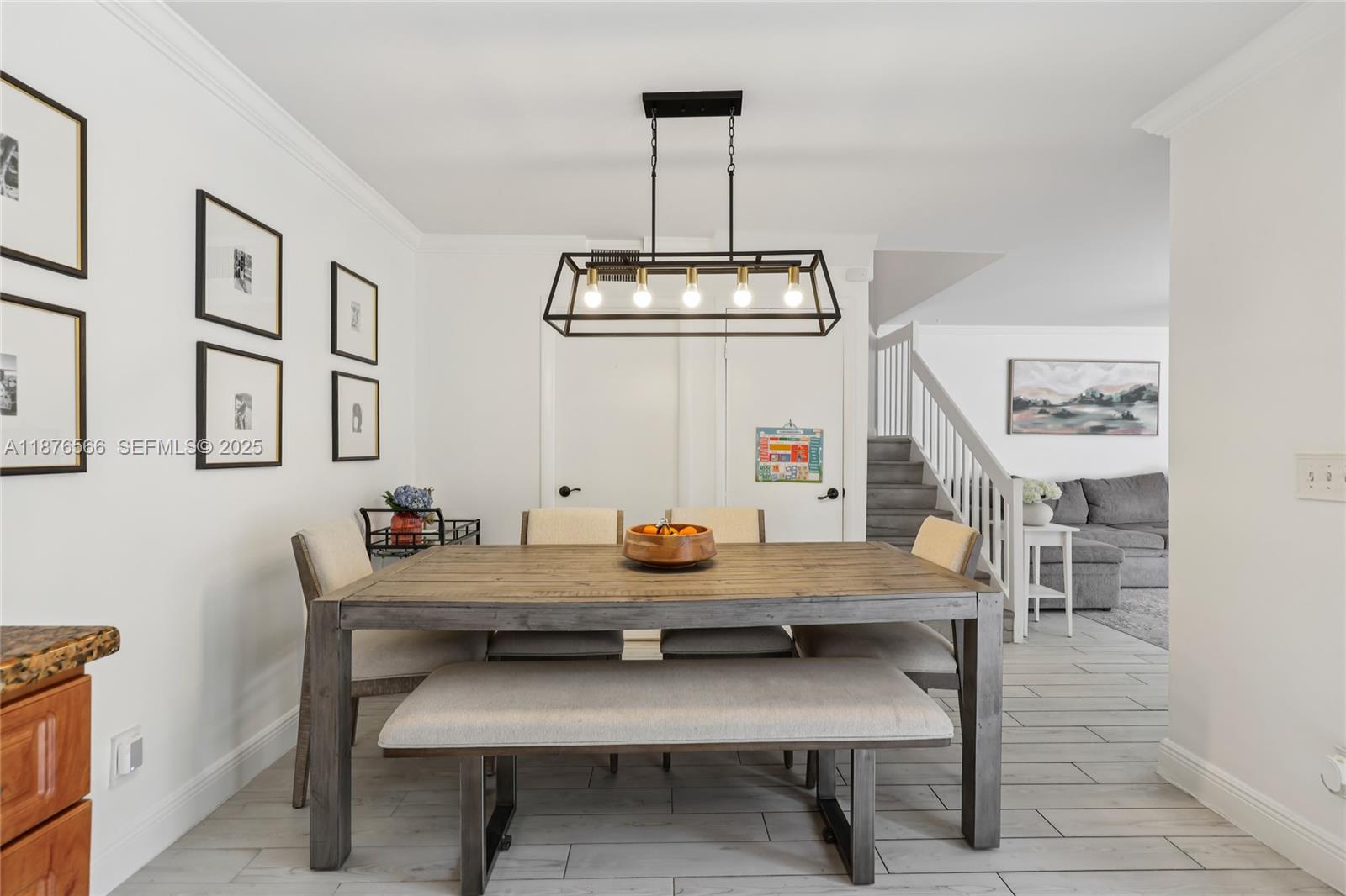 751 Southwest 120th Way Davie, FL 33325 - Photo 12 of 43 a view of a dining room with furniture and wooden floor