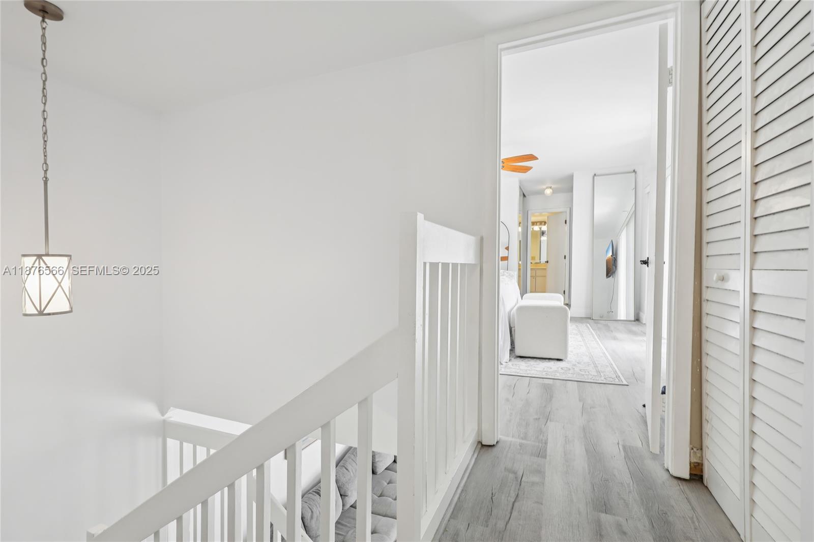 751 Southwest 120th Way Davie, FL 33325 - Photo 19 of 43 a view of a hallway with wooden floor