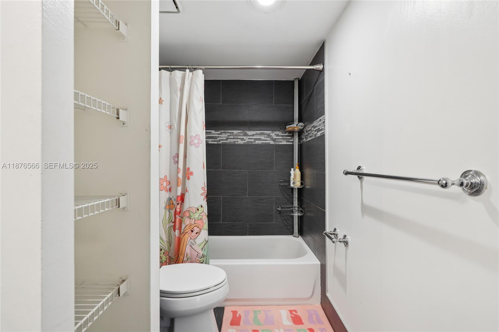 751 Southwest 120th Way Davie, FL 33325 - Photo 21 of 43 a bathroom with a toilet and a shower