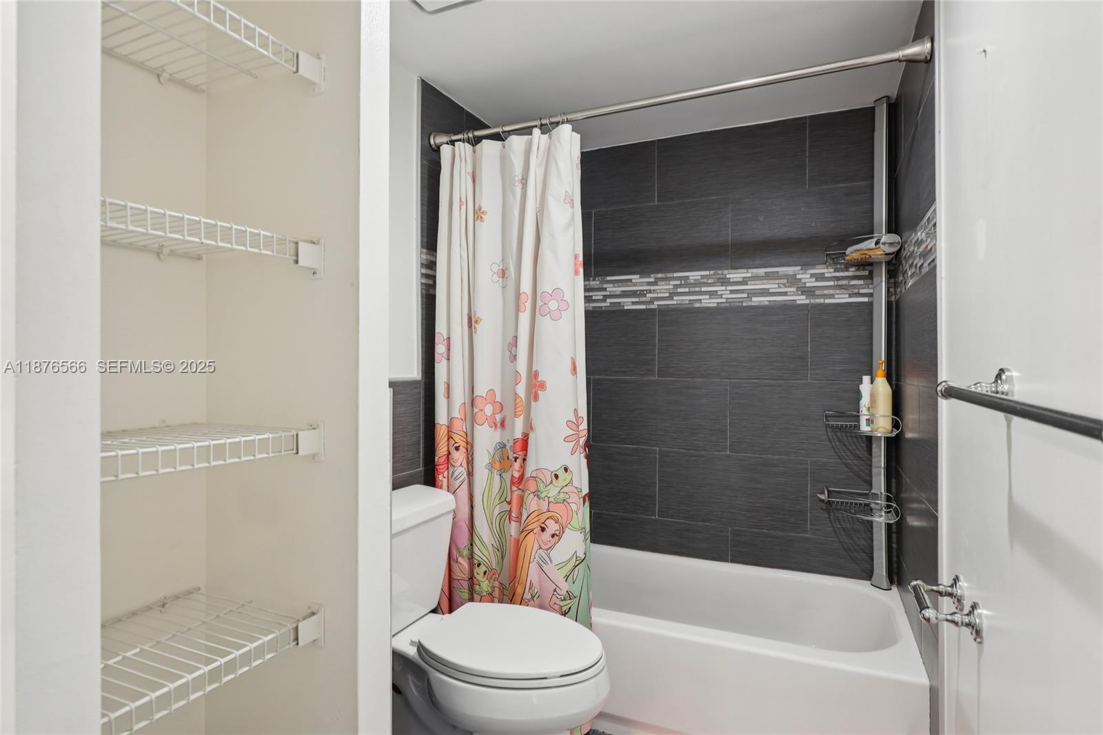 751 Southwest 120th Way Davie, FL 33325 - Photo 23 of 43 a bathroom with a toilet and a bathtub