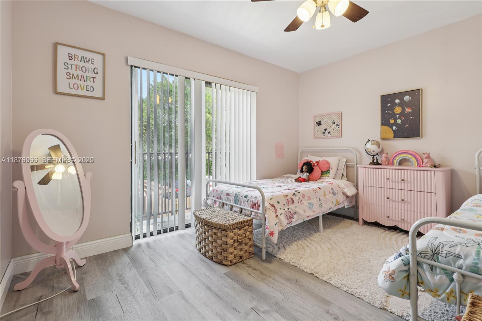 751 Southwest 120th Way Davie, FL 33325 - Photo 24 of 43 a bedroom with a bed window and table