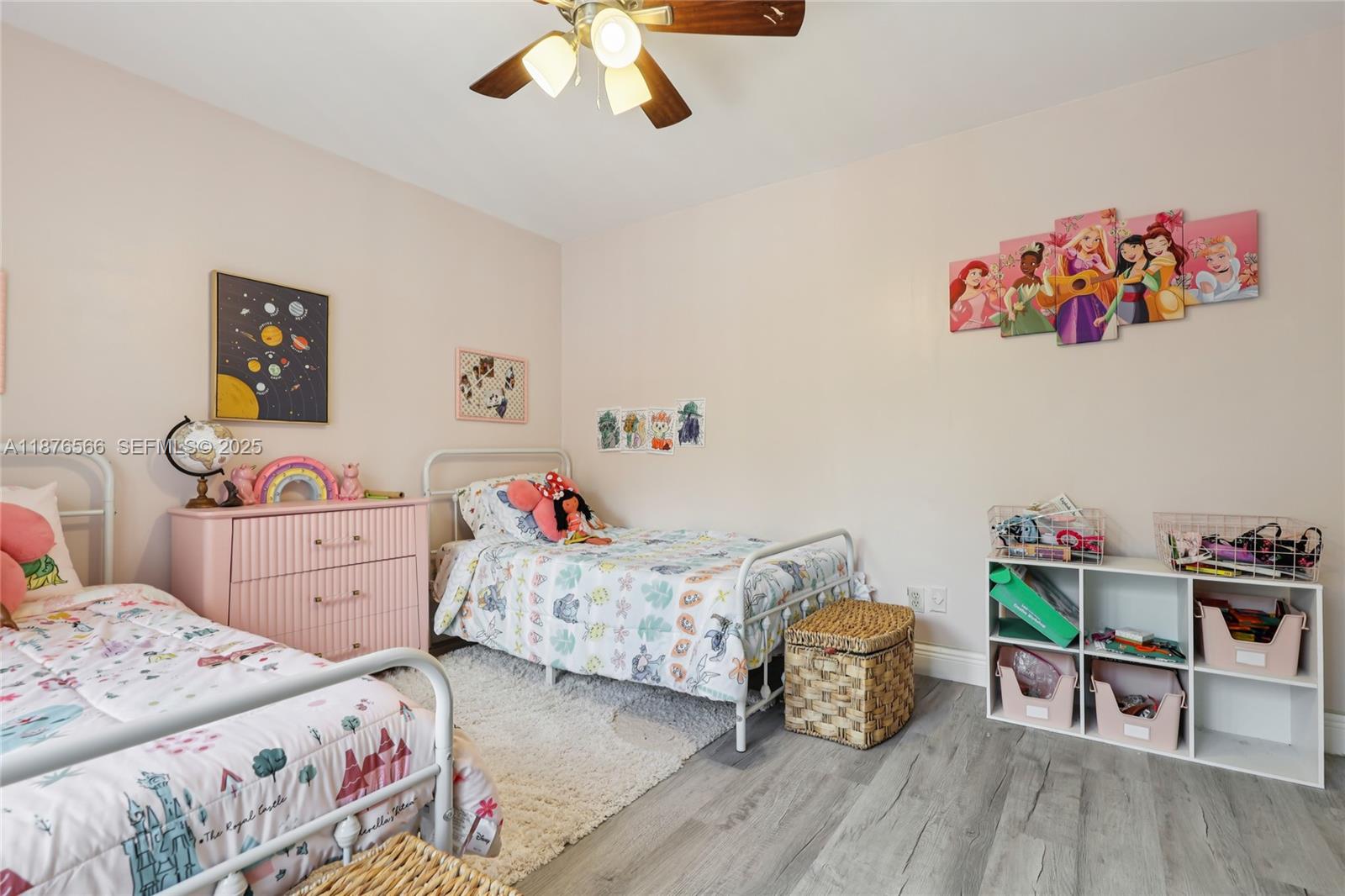 751 Southwest 120th Way Davie, FL 33325 - Photo 26 of 43 a bedroom with a bed and wooden floor