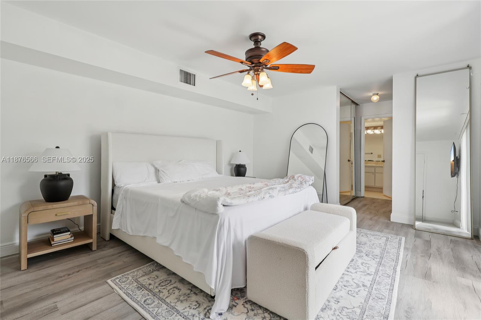 751 Southwest 120th Way Davie, FL 33325 - Photo 27 of 43 a bedroom with a bed and a chandelier