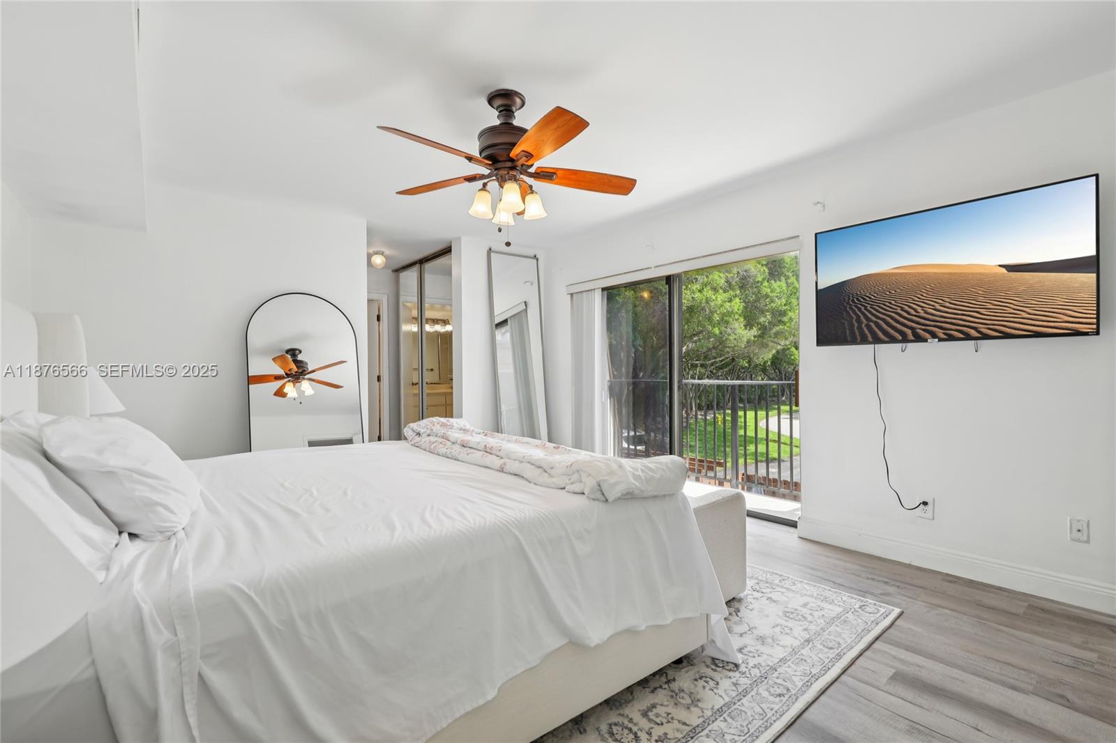 751 Southwest 120th Way Davie, FL 33325 - Photo 30 of 43 a bedroom with a large bed and a window