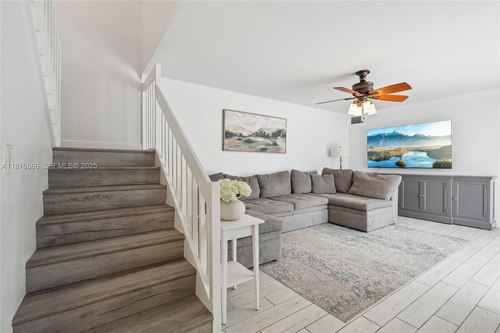 751 Southwest 120th Way Davie, FL 33325 - Photo 3 of 43 a living room with furniture and a painting