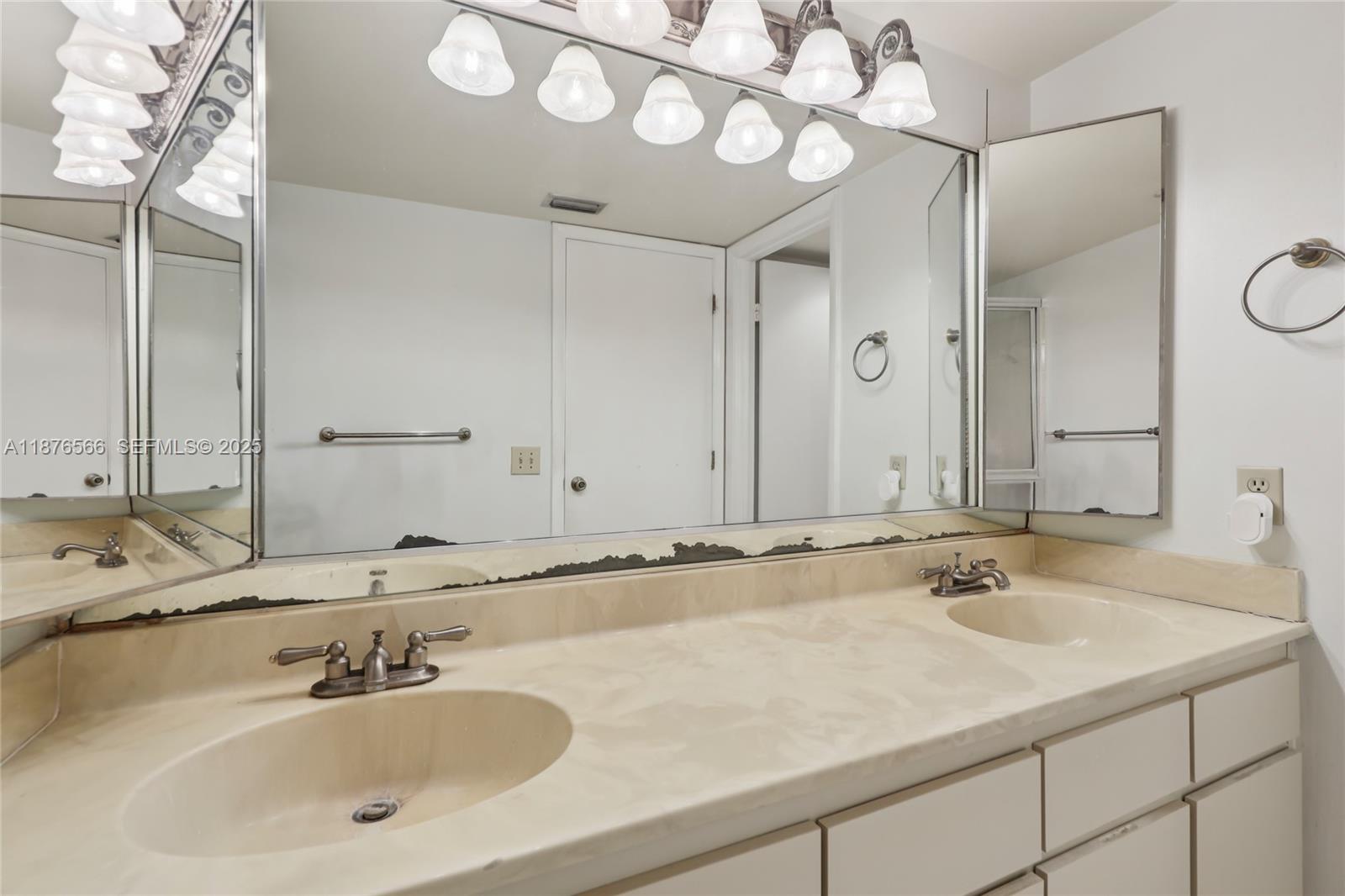 751 Southwest 120th Way Davie, FL 33325 - Photo 33 of 43 a bathroom with a sink and a mirror