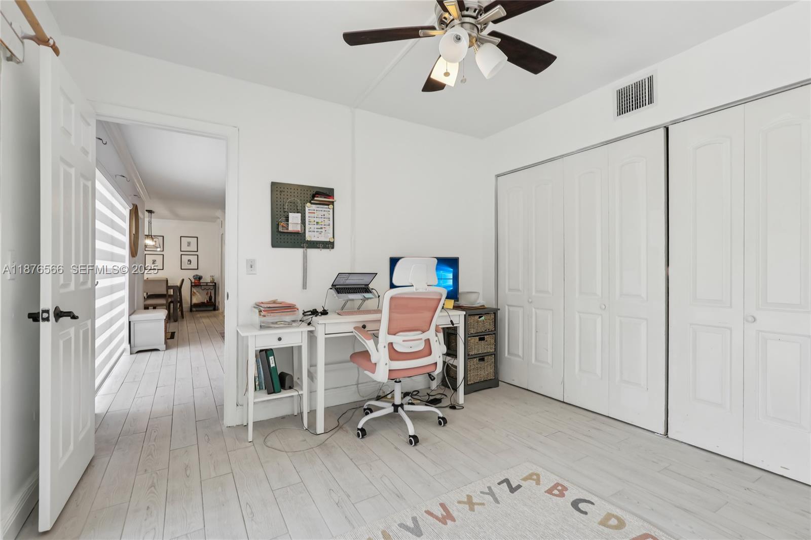 751 Southwest 120th Way Davie, FL 33325 - Photo 37 of 43 a workspace with furniture and wooden floor