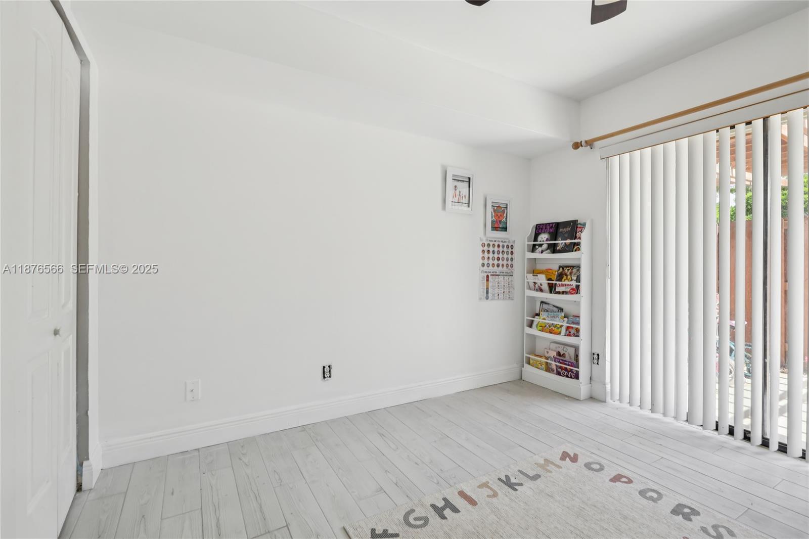 751 Southwest 120th Way Davie, FL 33325 - Photo 38 of 43 an empty room with shelves