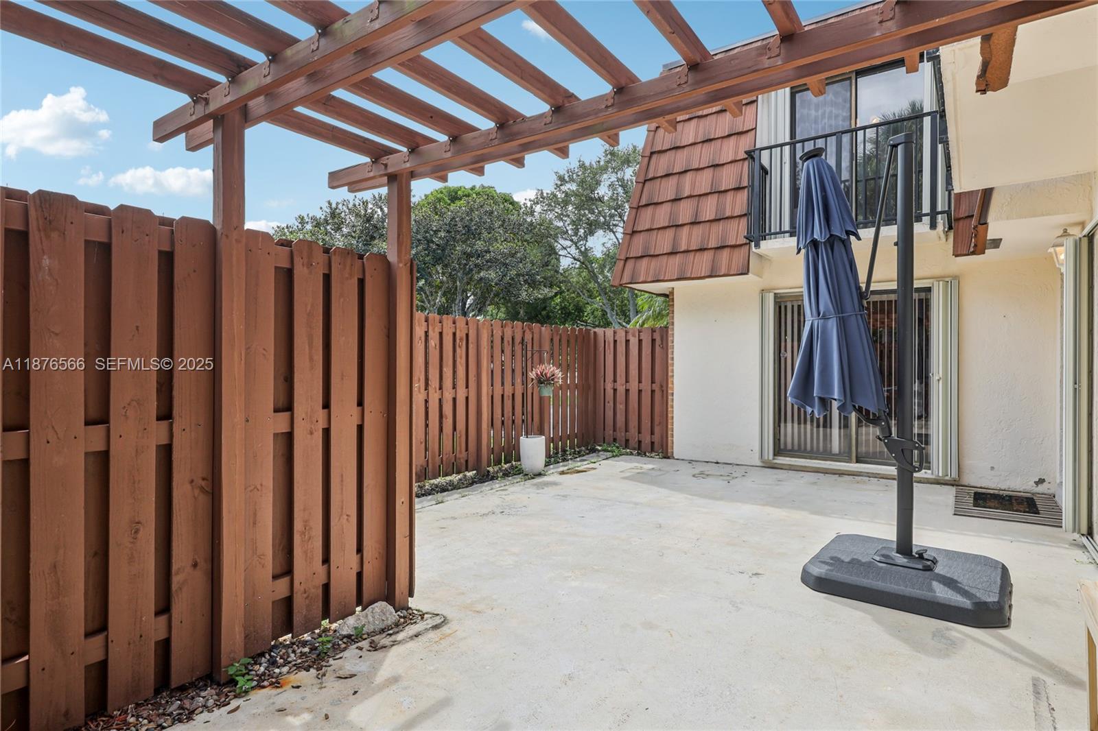 751 Southwest 120th Way Davie, FL 33325 - Photo 39 of 43 a view of staircase with wooden fence