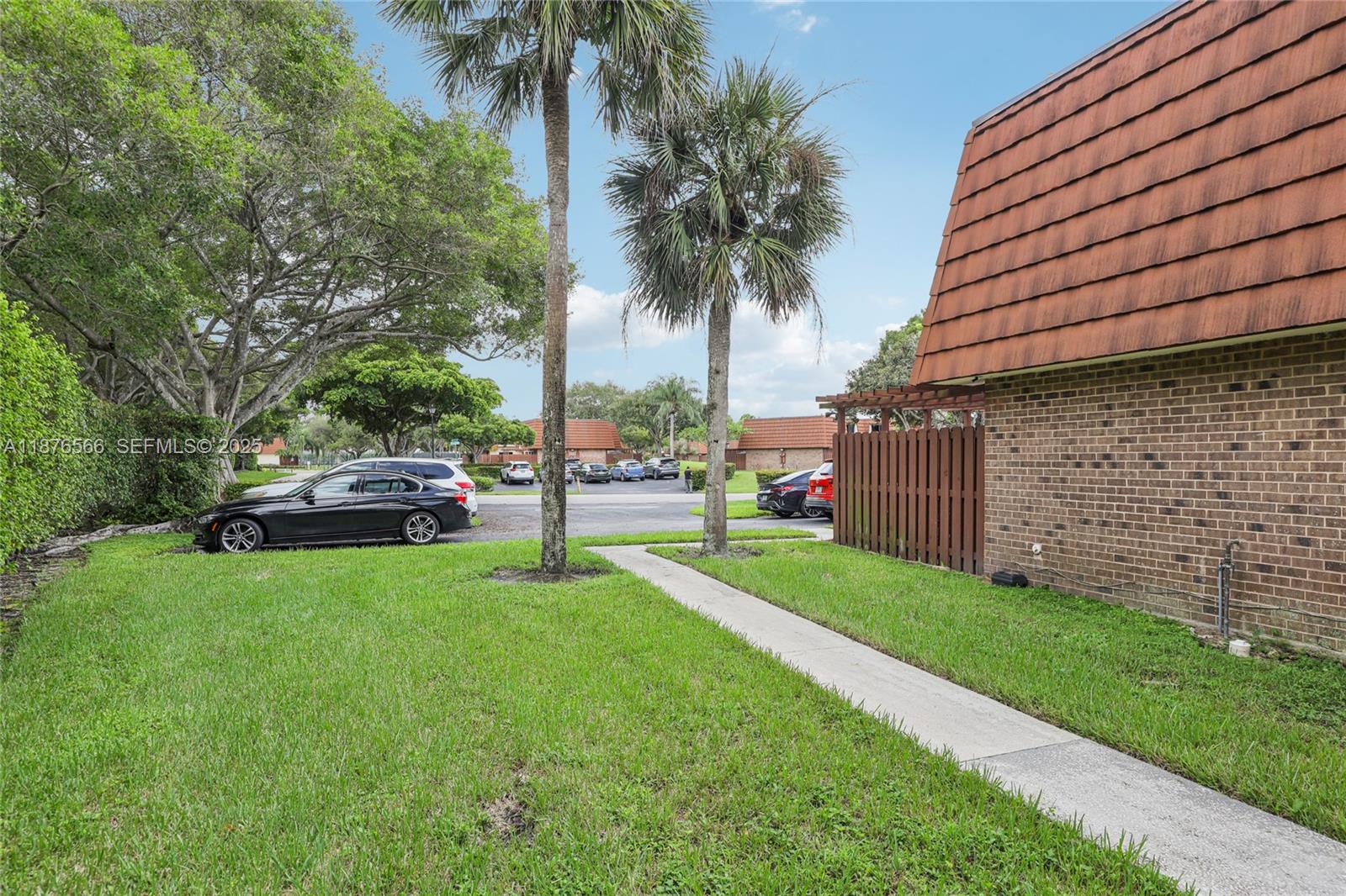 751 Southwest 120th Way Davie, FL 33325 - Photo 42 of 43 a view of a yard with a car parked