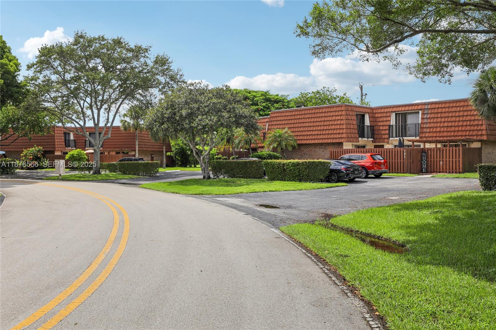 751 Southwest 120th Way Davie, FL 33325 - Photo 43 of 43 a front view of a house with a yard and garage