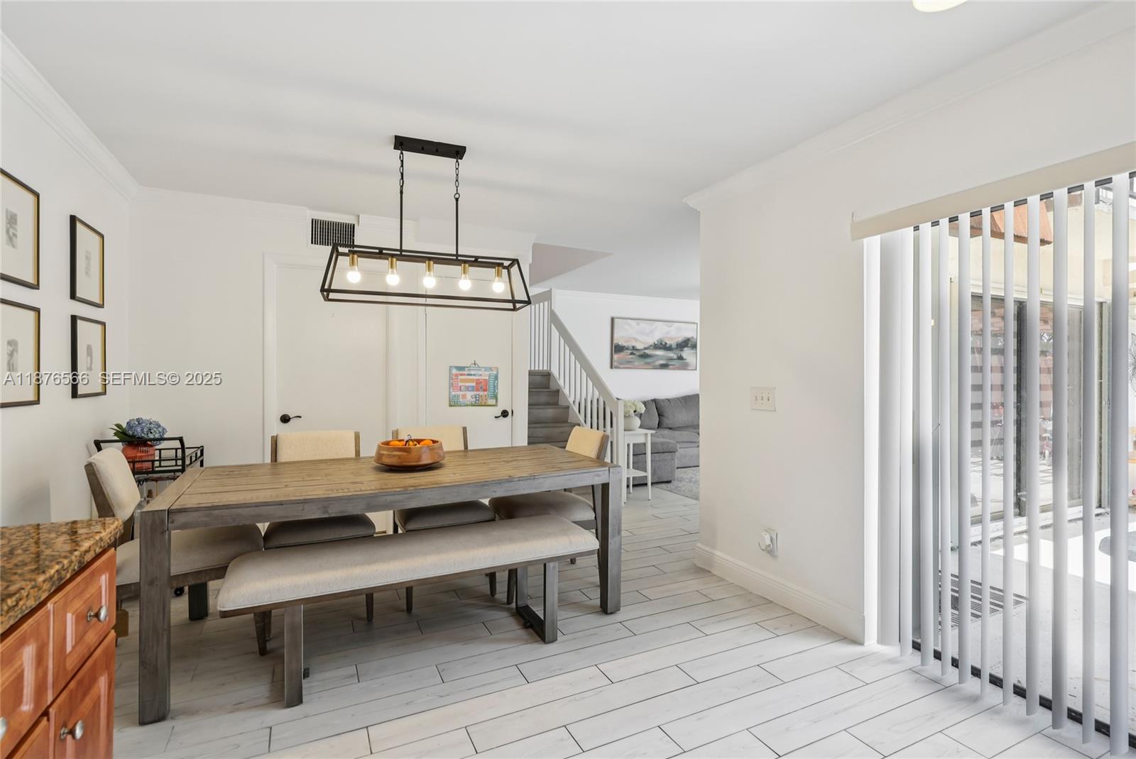 751 Southwest 120th Way Davie, FL 33325 - Photo 10 of 43 a view of a room with furniture and wooden floor