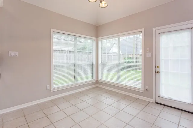 a view of an empty room and window