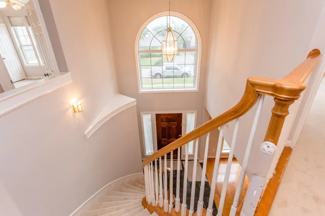 a view of entryway with wooden floor and door
