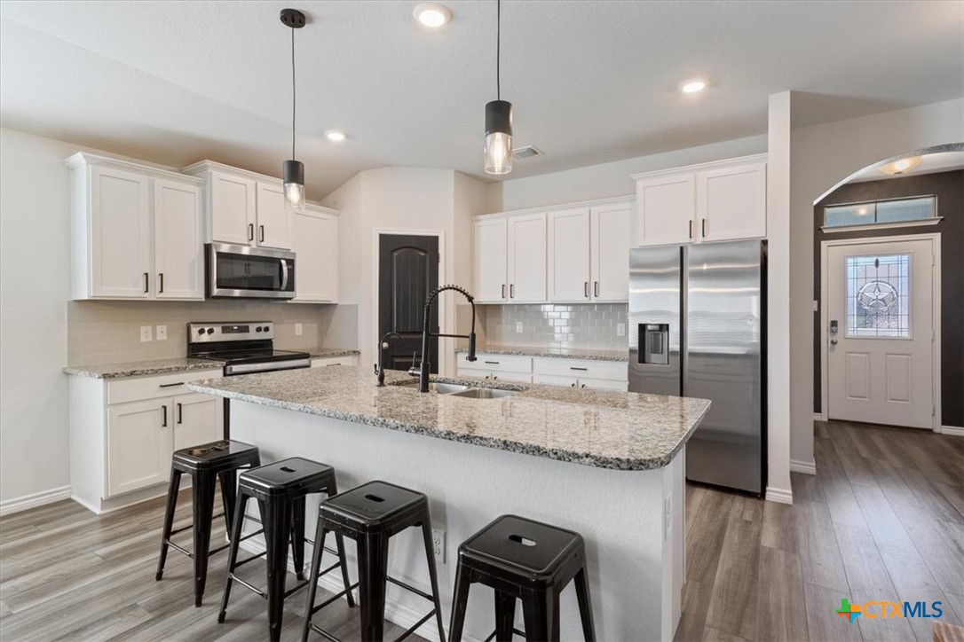 5945 Galveston Road Belton, TX 76513 - Photo 13 of 29 The finishes that were chosen for this kitchen are so nice and will compliment any decoration style.