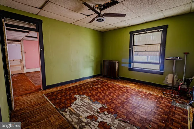 a bathroom with a sink a toilet and shower curtain