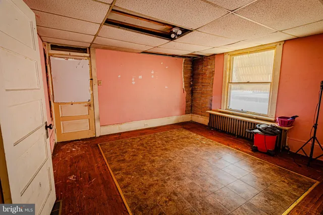a view of a hallway with the wooden floor