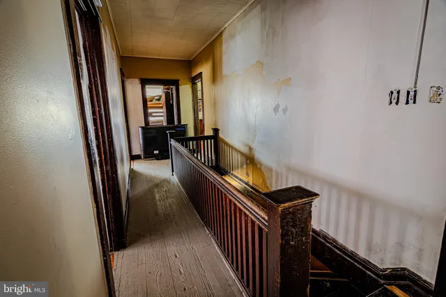 a bedroom with a bed dresser and a window